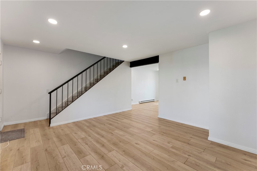Living Room with LVP Flooring - 210 Carriage B, Santa Ana CA 92707 - photo 5