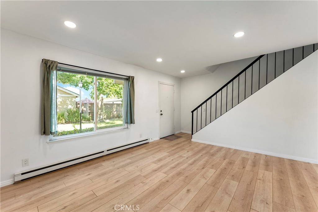 Living Room with LVP Flooring - 210 Carriage B, Santa Ana CA 92707 - photo 6