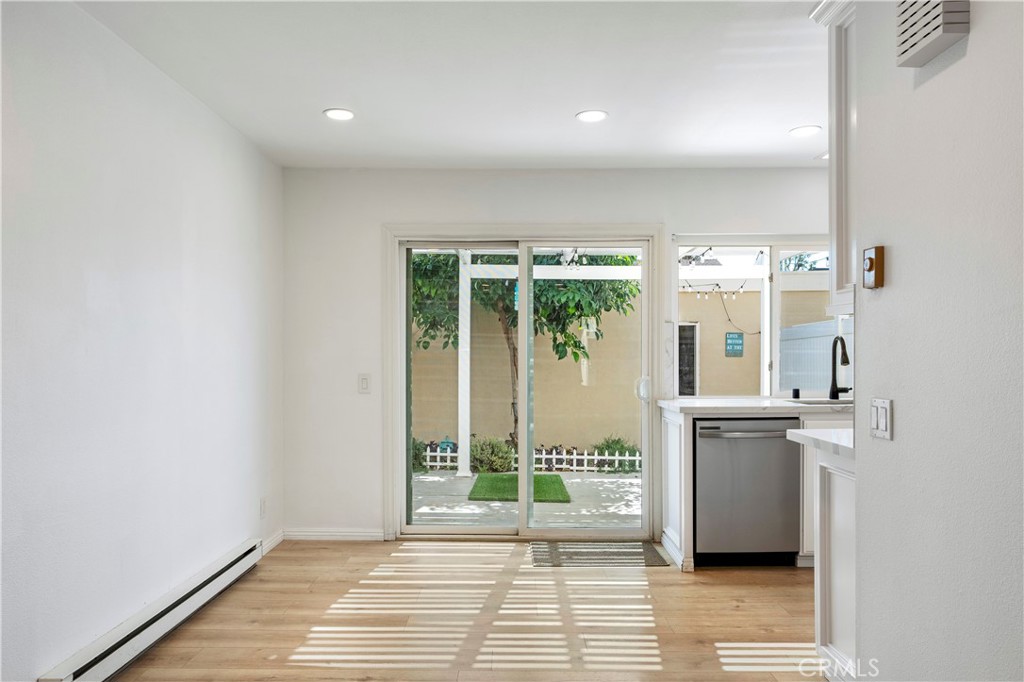 Dining Area with LVP Flooring - 210 Carriage B, Santa Ana CA 92707 - photo 8