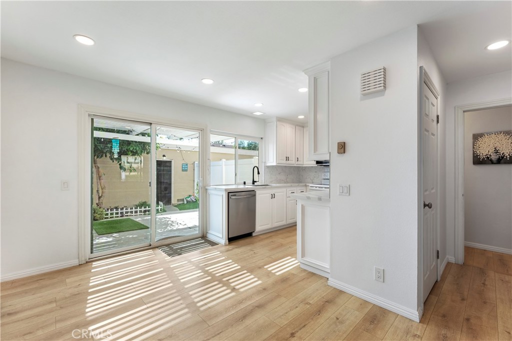 Dining Area with LVP Flooring - 210 Carriage B, Santa Ana CA 92707 - photo 10