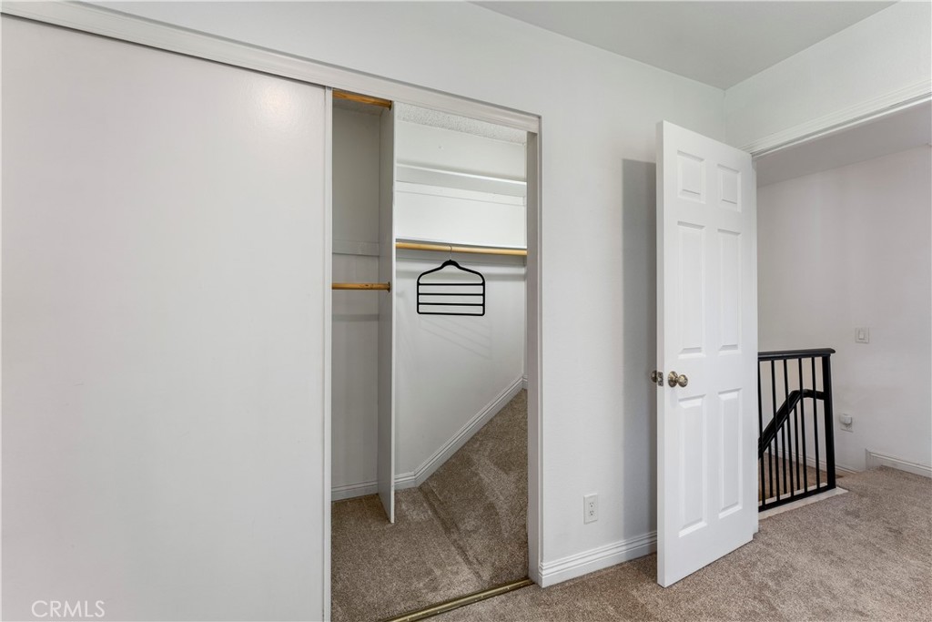 Primary Bedroom Closet with extra storage space! - 210 Carriage B, Santa Ana CA 92707 - photo 26