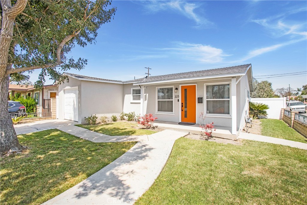 Situated on an interior corner lot, this single level home has everything you need. - 225 E Occidental Street, Santa Ana CA 92707 - photo 1