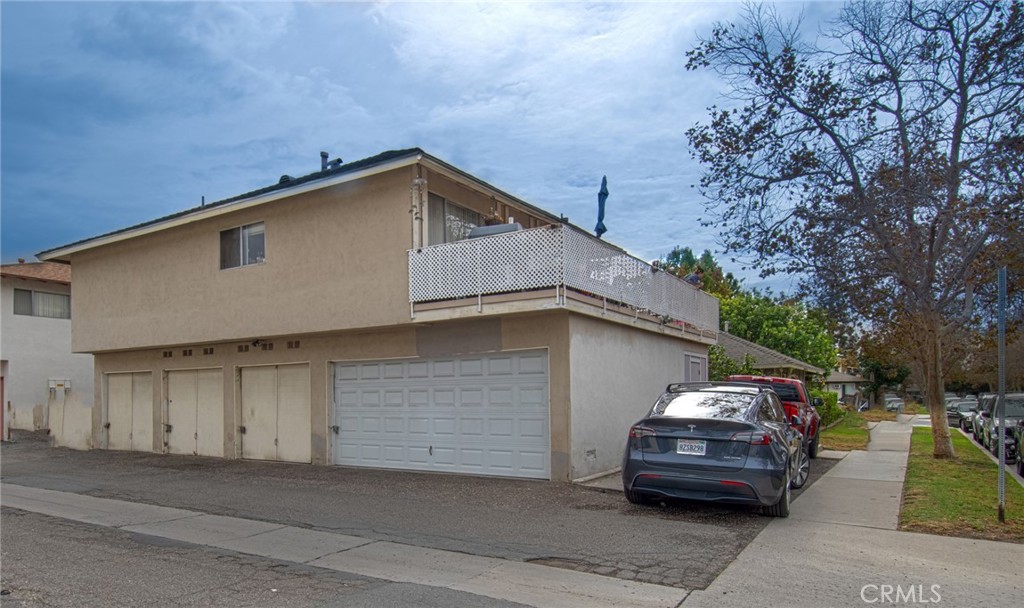 Rear Exterior - Garaging for 4 cars with individual laundry in each garage and extra parking - 2731 W Orion Avenue, Santa Ana CA 92704 - photo 20