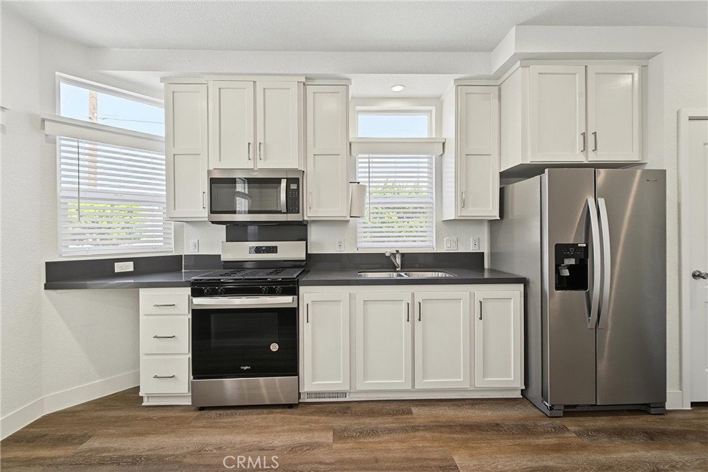 All stainless appliances. Hardwood cabinets with soft-close drawers and hidden hinges. - 2767 W 1st Street 14, Santa Ana CA 92703 - photo 6