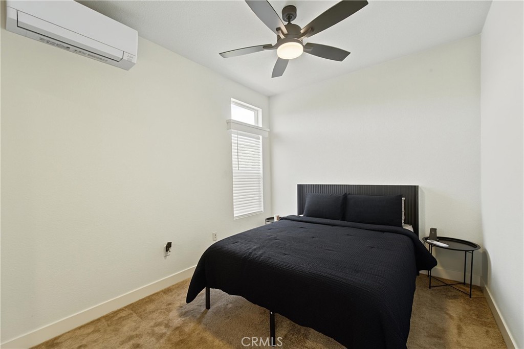 Primary with ceiling fan and mini split - 2767 W 1st Street 14, Santa Ana CA 92703 - photo 10