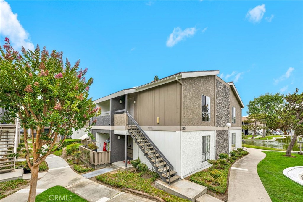 Located in the highly desirable Lakeshore Tennis Club Condominium community - 2857 S Fairview Street J, Santa Ana CA 92704 - photo 1