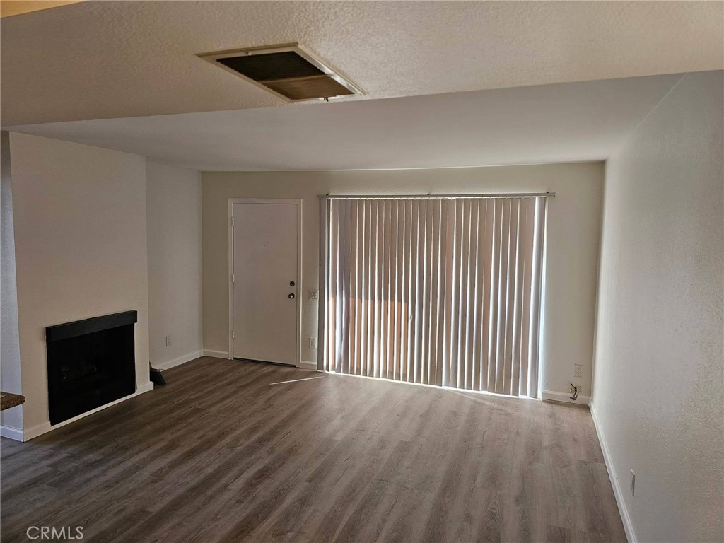 Living Room with Fireplace and front door - 2871 S Fairview Street D, Santa Ana CA 92704 - photo 1
