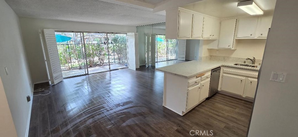 Open Design with Pool Views , Shutters , Freshly Painted - 3050 S Bristol Street 9D, Santa Ana CA 92704 - photo 1