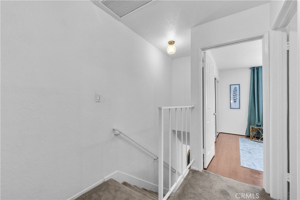 upstairs hallway leading into bedrooms - 3620 S Main C41, Santa Ana CA 92707 - photo 16