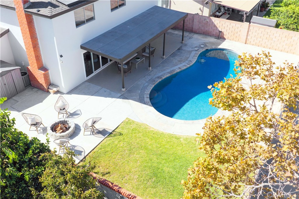 Drone image of large backyard space and saltwater swimming pool - 3709 S Olive Street, Santa Ana CA 92707 - photo 57