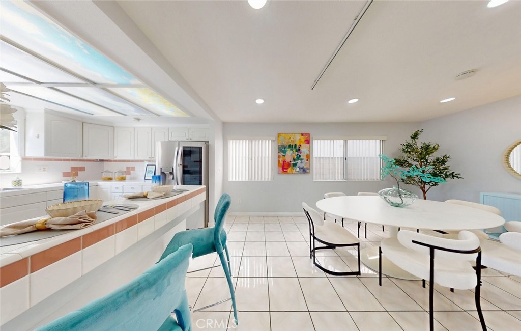 Kitchen and dining area with breakfast bar - 400 North Lisabeth, Santa Ana CA 92703 - photo 10