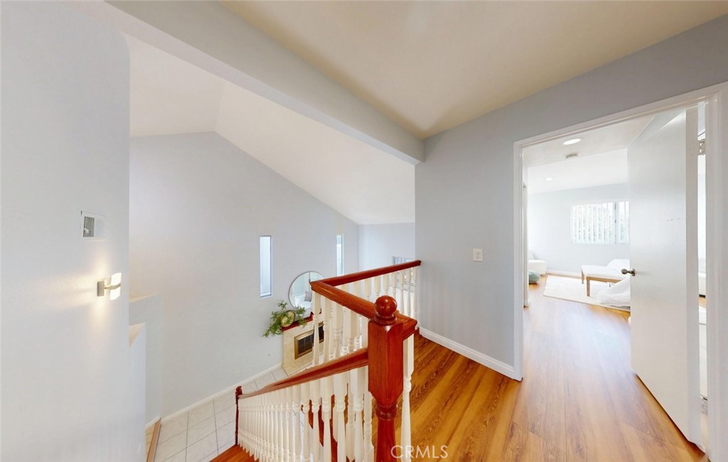 Upstairs hallway with hardwood flooring - 400 North Lisabeth, Santa Ana CA 92703 - photo 13