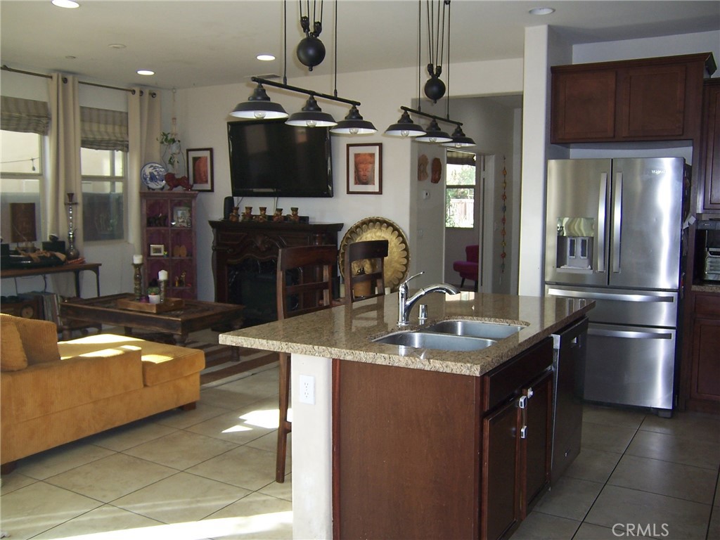 LIVING ROOM/KITCHEN VIEW - 4272 5th Street W, Santa Ana CA 92703 - photo 9