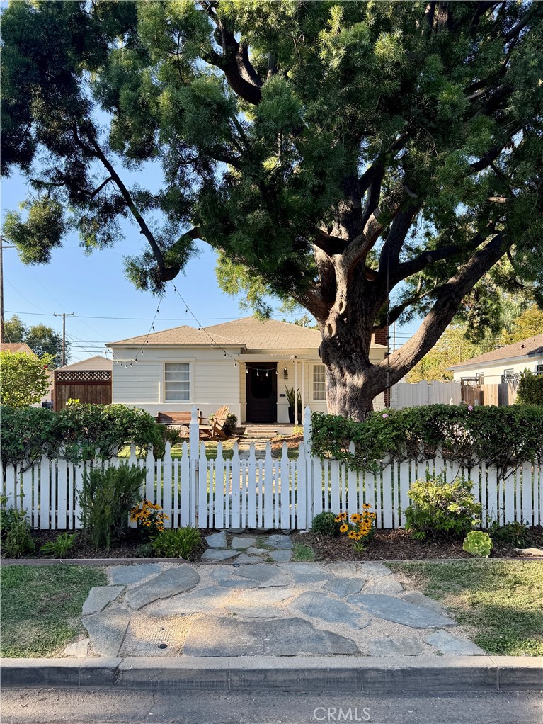 Set under a mature Podocarpus tree - 621 E 20th Street, Santa Ana CA 92706 - photo 1