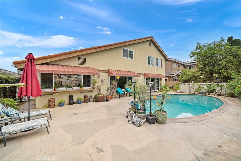 Resort-Style Backyard with Sparkling Pool and Spa, Huge Deck Area, Awnings for Shade, and Tropical Landscaping - 622 W Alpine Avenue, Santa Ana CA 92707 - photo 2