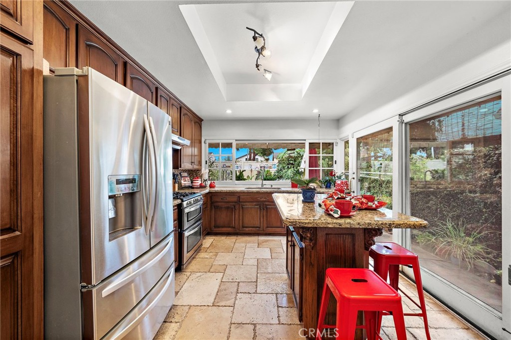 What a Great Kitchen that Overlooks the Resort Backyard and is so Warm, Inviting, and Beautiful with a Moveable Center I - 622 W Alpine Avenue, Santa Ana CA 92707 - photo 9