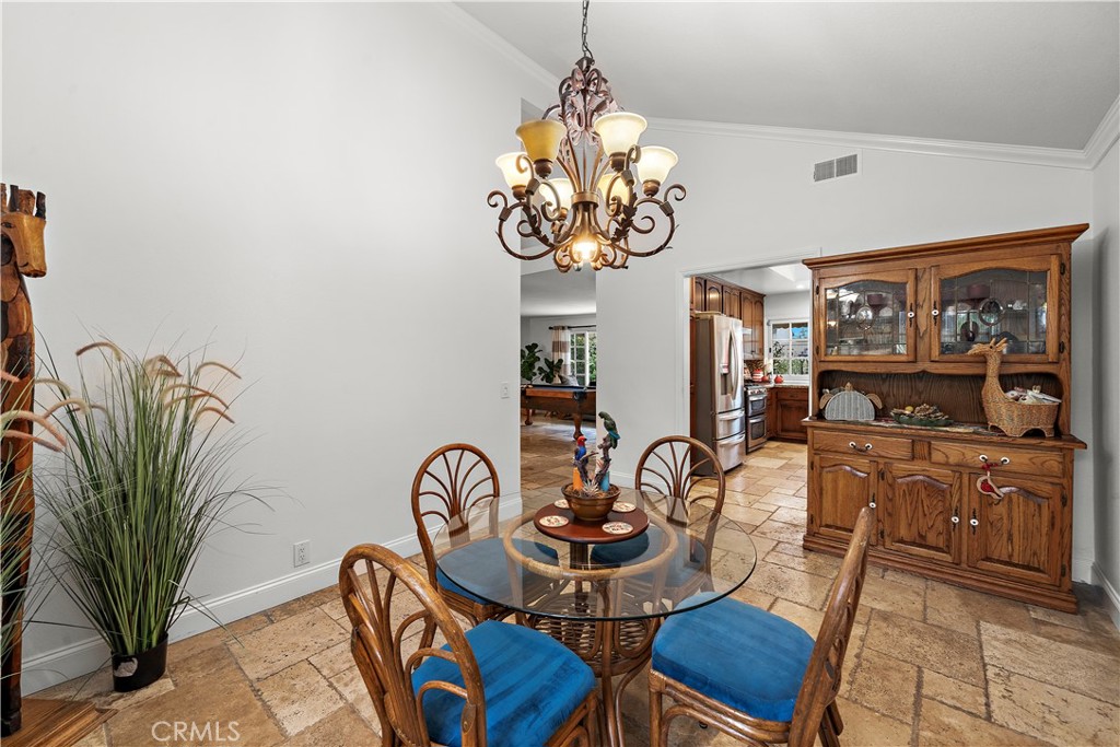 Formal Dining Room Opens to Kitchen and Living Room - 622 W Alpine Avenue, Santa Ana CA 92707 - photo 13