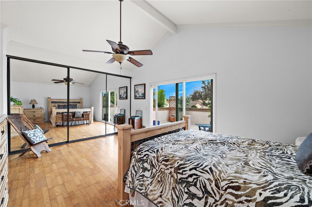 Primary Suite with Cathedral Ceiling, Fan, Double Wide Mirored Closets, and Siders that Open to a Large Private Balcony/ - 622 W Alpine Avenue, Santa Ana CA 92707 - photo 22