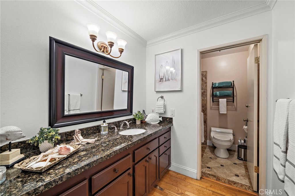 Primary Suite Bathroom with Granite Topped Vanity - 622 W Alpine Avenue, Santa Ana CA 92707 - photo 26