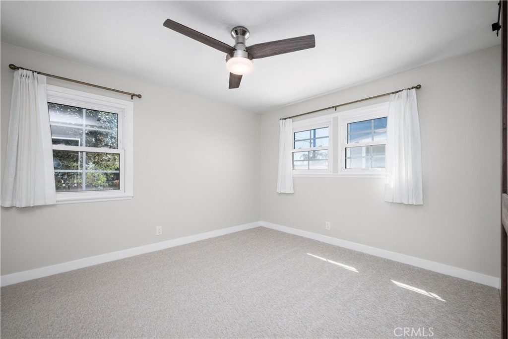 Main bedroom cross ventilation and ceiling fan keeps this room light and breezy. - 1200 Catalina Avenue, Seal Beach CA 90740 - photo 16