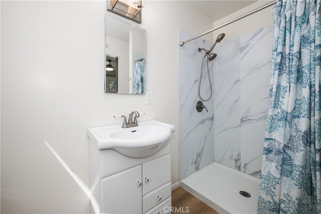 The main room bath features a spacious walk-in shower. - 1200 Catalina Avenue, Seal Beach CA 90740 - photo 19