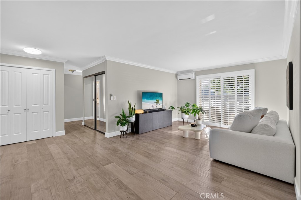 Coat Closet, hall mirrored linen closet. Living room as full length shutters. Mini splits in every room make it most enj - 12200 Montecito Road B112, Seal Beach CA 90740 - photo 4