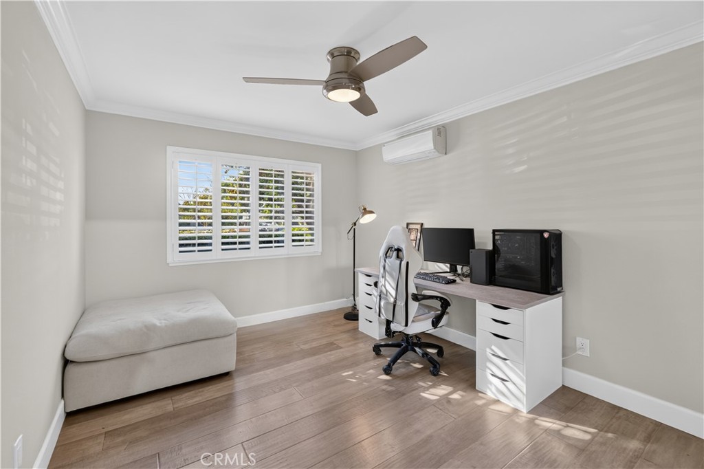 Guest bedroom has mini split, shutters and luxury vinyl flooring. - 12200 Montecito Road B112, Seal Beach CA 90740 - photo 12