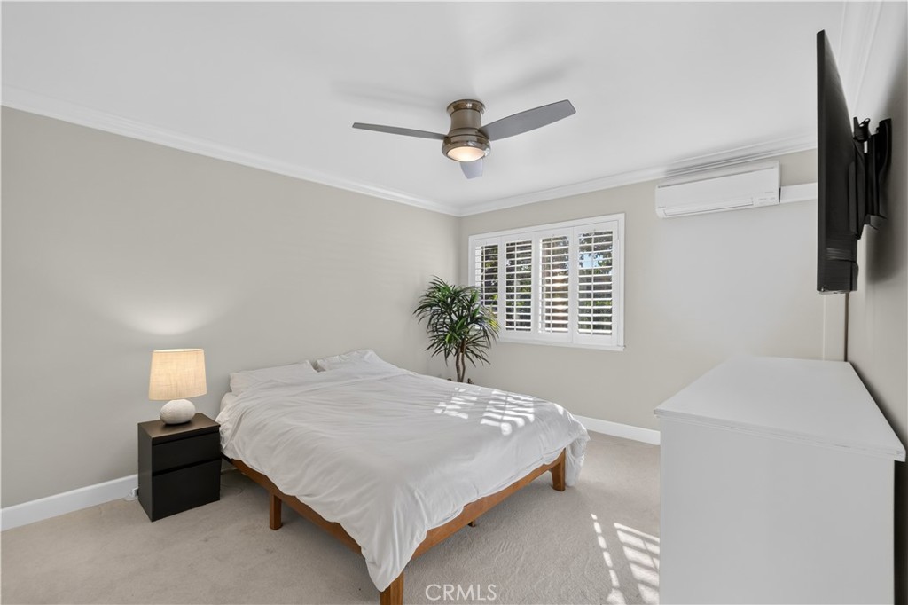 Primary Bedroom has carpet, shutters and mini split. - 12200 Montecito Road B112, Seal Beach CA 90740 - photo 14
