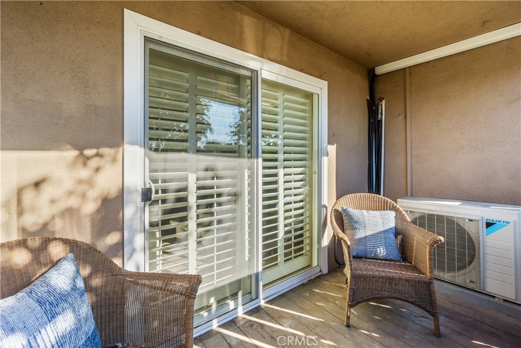 View of back patio with sliding glass door to the living room. - 12200 Montecito Road B112, Seal Beach CA 90740 - photo 19