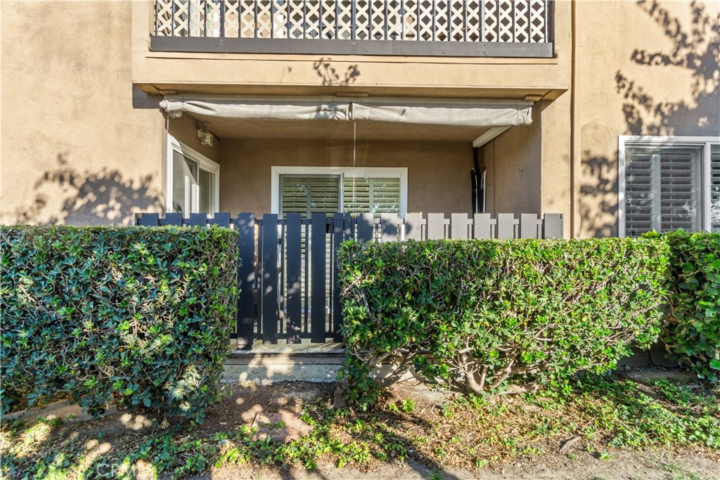 View of the back patio from the green belt common area - 12200 Montecito Road B112, Seal Beach CA 90740 - photo 21