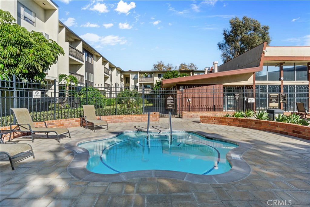 Enjoy the spa at the Main Pool. The Club House and Gym are located just beyond the gate. - 12200 Montecito Road B112, Seal Beach CA 90740 - photo 24