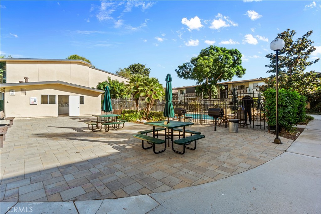 A picnic area with BBQ's are just outside the laundry facility. - 12200 Montecito Road B112, Seal Beach CA 90740 - photo 27