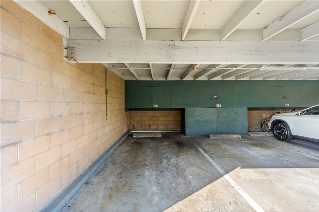 Carport 155 with storage cabinets. - 12200 Montecito Road B112, Seal Beach CA 90740 - photo 29