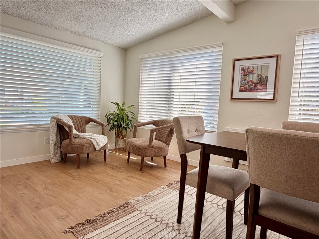 Light-filled area with large windows and an open, comfortable layout. - 13560 Medinac Lane 102 L, Seal Beach CA 90740 - photo 4