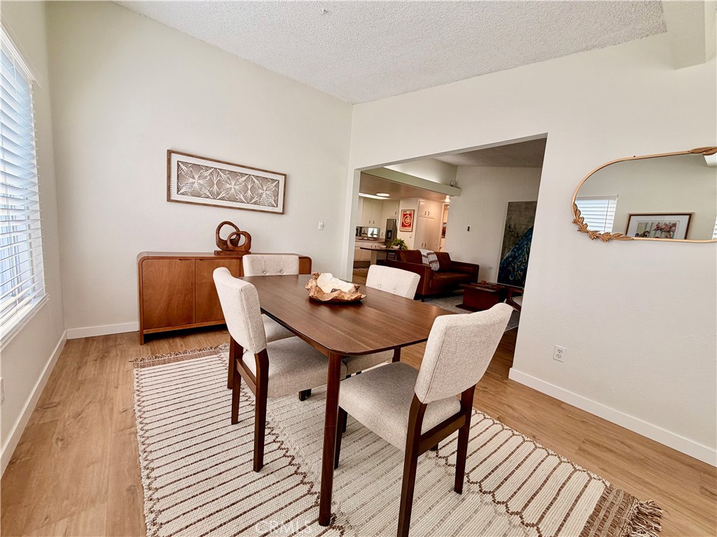 Formal dining room offering an ideal space for entertaining family and friends. - 13560 Medinac Lane 102 L, Seal Beach CA 90740 - photo 5