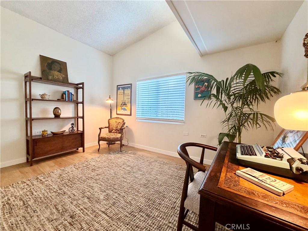 Flexible bonus space ideal for a home office, reading area, or additional sitting room. - 13560 Medinac Lane 102 L, Seal Beach CA 90740 - photo 12