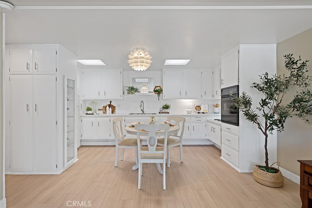 View from living area into dining & kitchen - 13730 Annandale Drive M1-32K, Seal Beach CA 90740 - photo 1