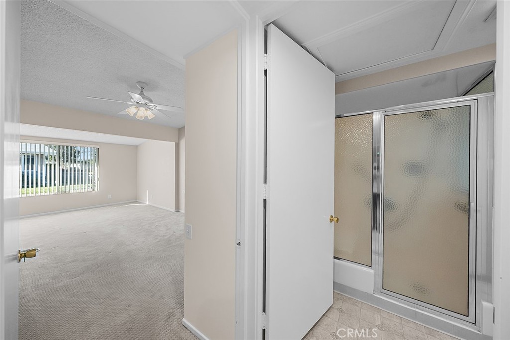 Bathroom is accessible from hall and adjacent to Primary Bedroom - 1441 Homewood Road M5-96C, Seal Beach CA 90740 - photo 23