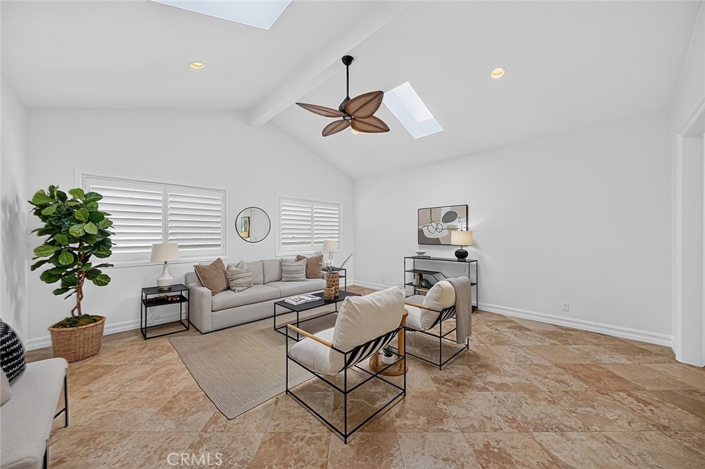 Large family room off the back with vaulted ceilings and lots of light through the skylights. - 154 12th, Seal Beach CA 90740 - photo 9
