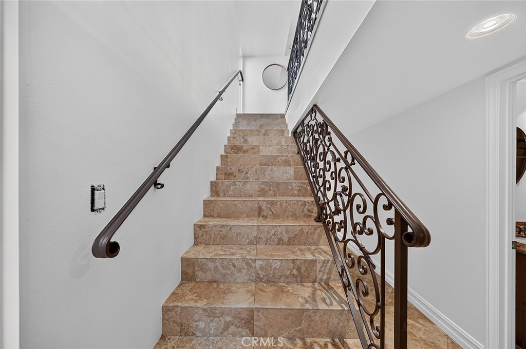 Tasteful banister leads from one floor to the next. - 154 12th, Seal Beach CA 90740 - photo 23