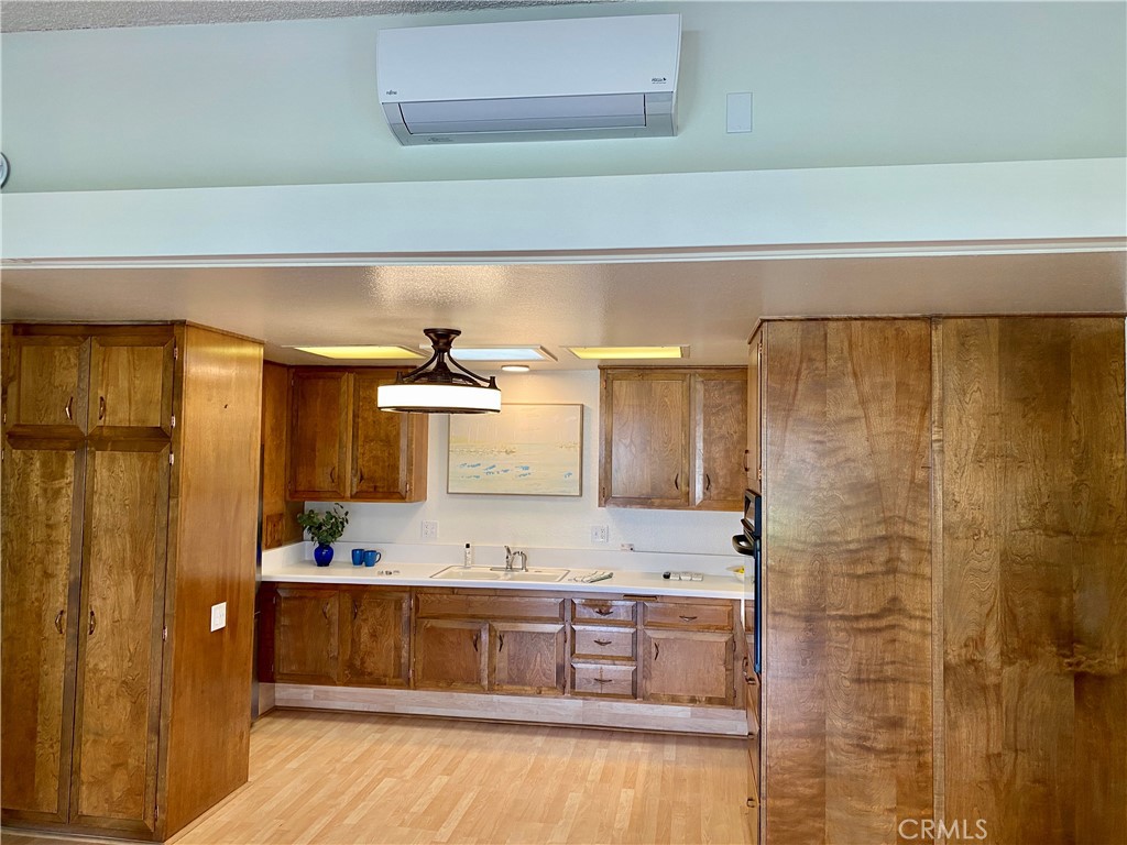 open concept living area has heat and AC - 1640 Glenview Rd. M12-76i, Seal Beach CA 90740 - photo 1