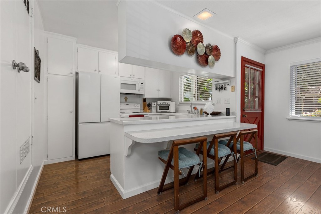 Bright, open kitchen with plenty of cabinet & counter space! Love the lower counter for the breakfast bar & how it flows - 29501 Silverado Canyon Road, Silverado Canyon CA 92676 - photo 3