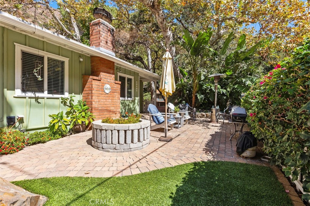 Front courtyard surrounded by lush foliage & mature oak & sycamore trees. - 29501 Silverado Canyon Road, Silverado Canyon CA 92676 - photo 8