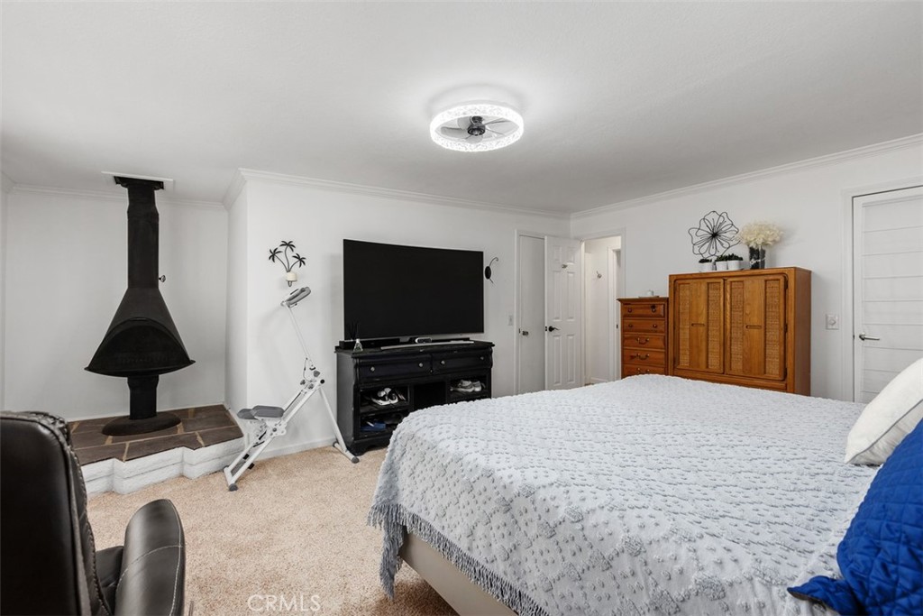 Primary suite has this outstanding wood burning fireplace & private entrance to the bathroom. - 29501 Silverado Canyon Road, Silverado Canyon CA 92676 - photo 20