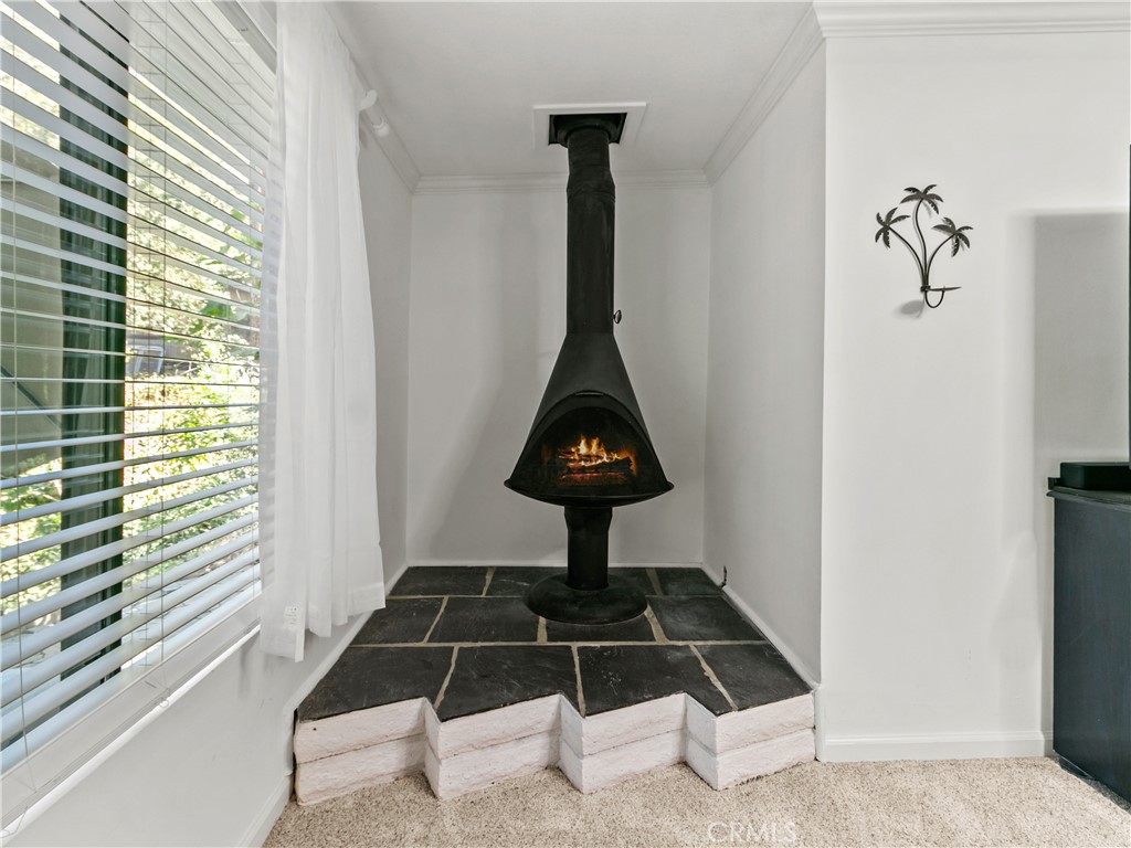 LOVE this fireplace in the master bedroom. Such character. AI enhanced fire. - 29501 Silverado Canyon Road, Silverado Canyon CA 92676 - photo 21