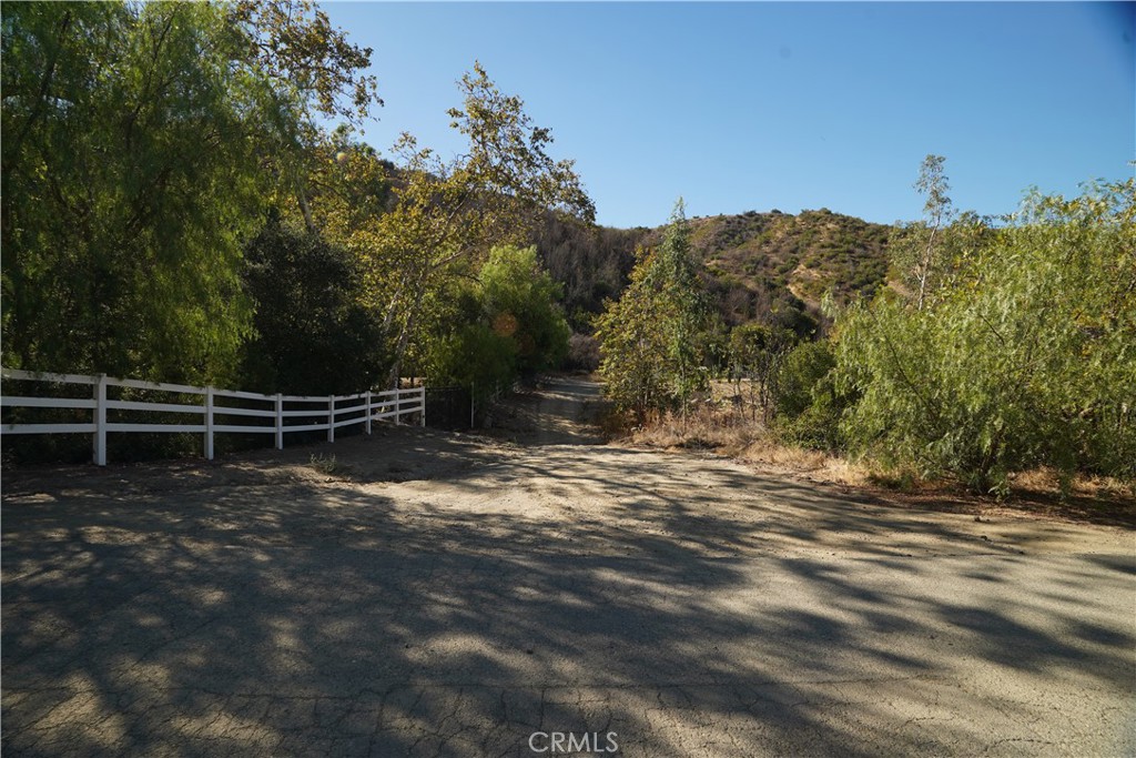 Turn right at this white fence. All dirt road uphill from here - 16 Williams Canyon, Silverado CA 92676 - photo 9