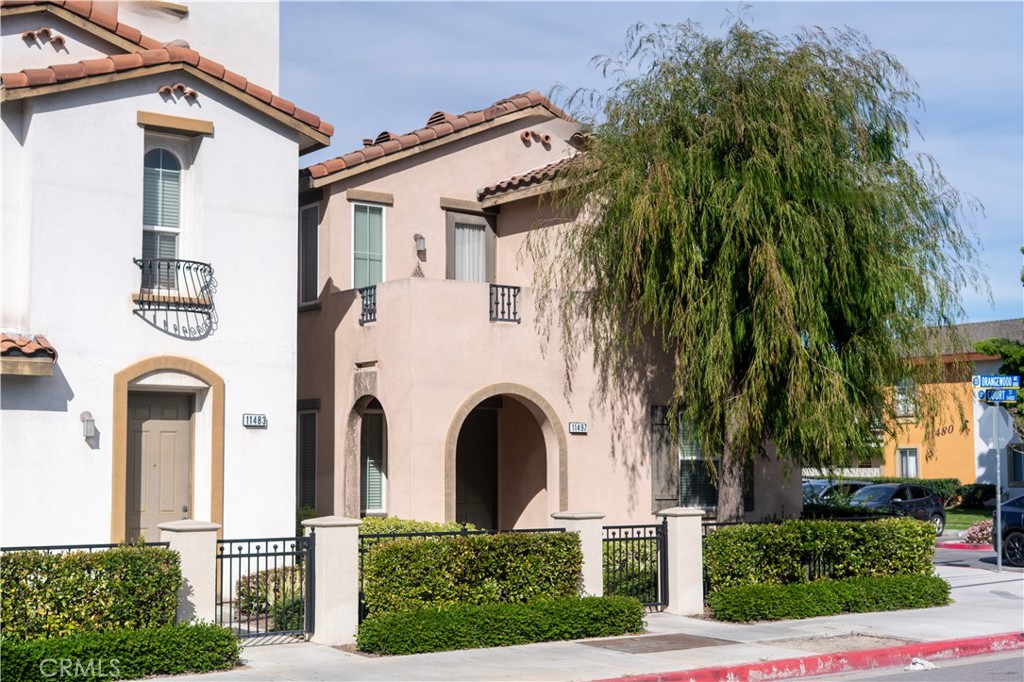 side angle, street view of the front of the property - 11497 Toscana, Stanton CA 90680 - photo 1