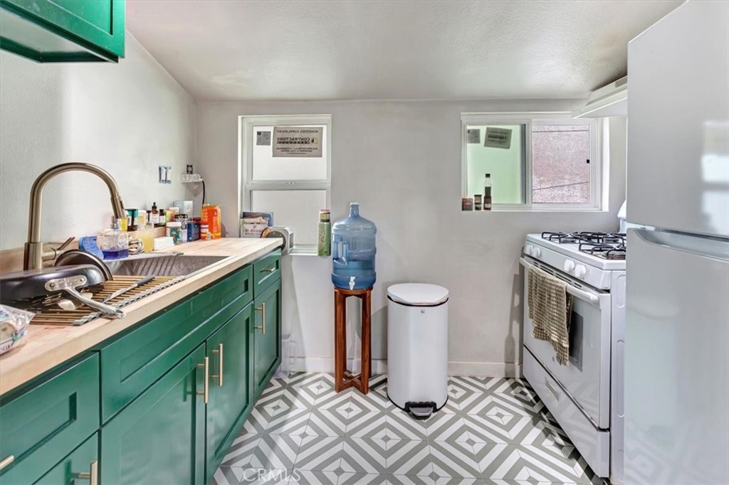 Rear Upper Unit Kitchen - 16432 25th Street, Sunset Beach CA 90742 - photo 13