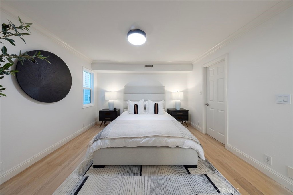 Downstairs bedroom with ensuite bath - 16955 S Pacific, Sunset Beach CA 90742 - photo 12