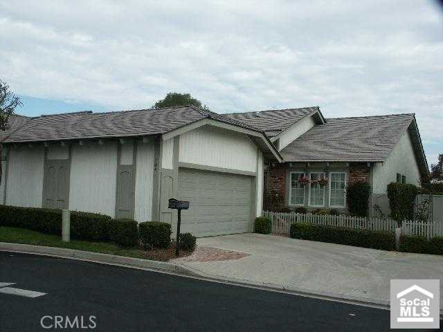Front view with attached 2 car gargage with direct access - 1041 Regis Way, Tustin CA 92780 - photo 1
